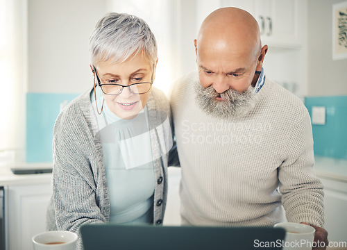 Image of Senior couple, laptop and video call in home kitchen, internet browsing or social media in house. Computer, retirement and man and woman on videocall, online chat or virtual communication together.