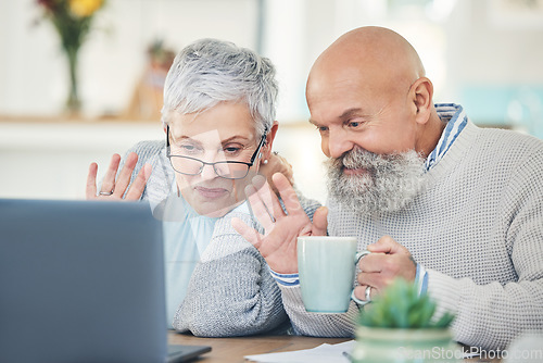 Image of Laptop, elderly couple and wave on video call with coffee in home, talking and speaking in house. Computer, retirement and man and woman waving to say hello in virtual chat, online greeting and happy