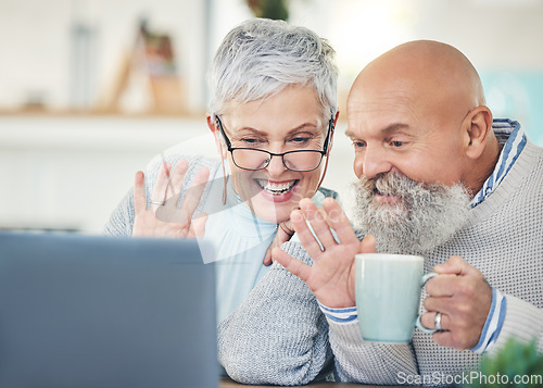 Image of Laptop, senior couple and wave on video call with coffee in home, talking and speaking in house. Computer, retirement and man and woman waving to say hello in virtual chat, online greeting and happy.