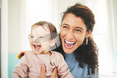 Image of Mother, laughing baby and a happiness in a family home while together for love, support and care. Woman or mom and girl child laugh for funny or comic joke for quality time, bonding and to relax