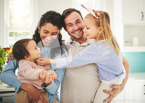 Image of Mother, father and children portrait in a happy family home while together for love, support and care. Woman, man or parents with girl kids playing in a house for quality time, bonding and to relax
