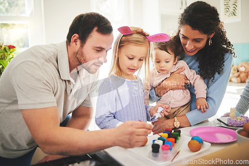 Image of Family, painting and eggs with kids learning to be creative on table at easter or color brush at home. Children, happy mother and father decorating together or dad with mom teaching young girl art.