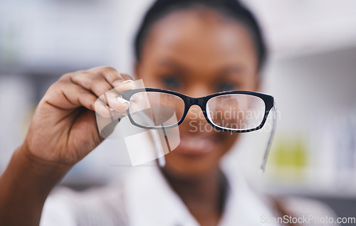 Image of Vision, eye care and woman with glasses hand, clinic for eye exam and help for poor sight with health and wellness. Eyesight, wellness and girl holding designer brand frame and lens for healthy eyes.