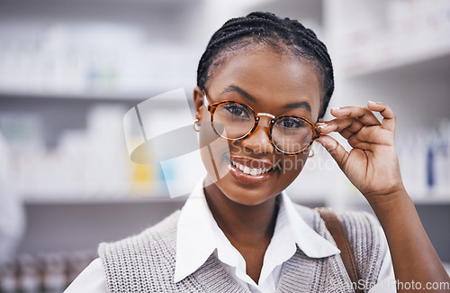 Image of Smile, eyesight and portrait of woman with glasses in clinic for eye exam, health and help with poor sight test. Vision, happy face of girl holding frame from designer eyewear brand and care for eyes