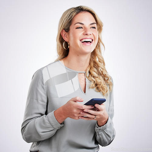 Image of Woman, laughing and phone in studio for communication, funny post or video on a white background. Female person laugh for comic meme on social media with a smartphone, internet and network connection