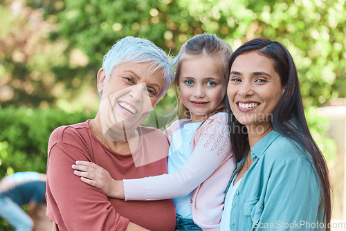 Image of Family, women and portrait in a garden with love, hug and happy while bonding outdoors. Face, smile and girl with mother and grandmother in a park, embrace and enjoying the weekend outside together