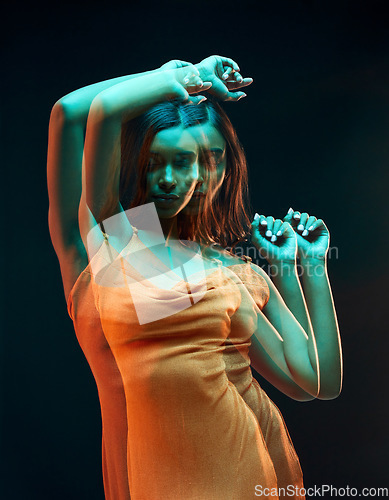 Image of Neon green light, double exposure and woman with beauty, glowing skin and art aesthetic. Creative dancing, young female and model with a dark background in a studio with modern fashion style