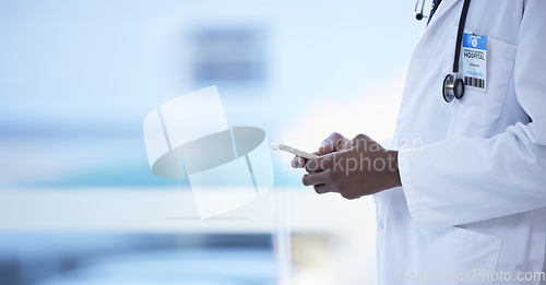 Image of Doctor, man and hands with phone in healthcare, communication or social media at the hospital. Hand of male medical professional chatting, texting or typing on mobile smartphone for health at clinic