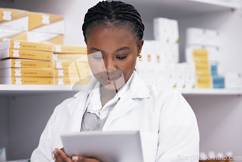 Image of Black woman in pharmacy with tablet, online inventory list and prescription medicine on shelf. Female pharmacist reading digital checklist, advice and medical professional checking drugs in store.