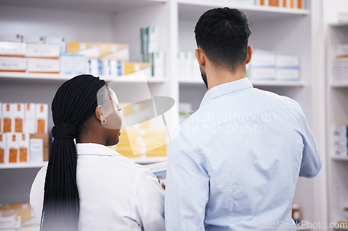 Image of Man shopping, medicine or back of pharmacist in pharmacy for retail healthcare information or advice. Black woman or doctor helping a customer with prescription medication, pills or medical drugs