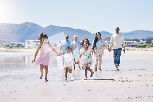 Image of Beach, big family and children holding hands, running and happiness on summer vacation together in Mexico. Sunshine, fun and bonding, men, women and kids on holiday walk on happy morning with energy.