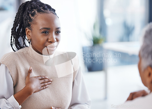 Image of Healthcare, patient and black woman with chest pain, sick and speaking to a doctor, hospital and illness. Female model, person or lady with heart problem, issue and medical professional with advice