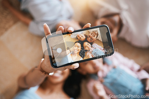 Image of Happy, relax and selfie of family on floor of living room for social media, communication and internet from above. Website, funny and picture with parents and children at home for love and bonding