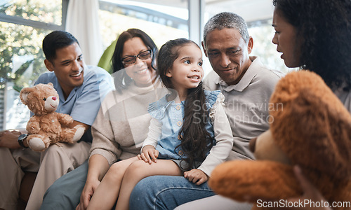 Image of Parents, grandparents and girl with teddy bear on sofa, bonding and smile for family in home living room. Men, women and female child with toys, love and happiness on lounge couch in house on holiday