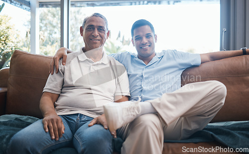 Image of Portrait of happy man with senior father on sofa, happiness and quality time together in living room of home in Mexico. Love, support and men on couch in lounge with smile, dad and adult son in house