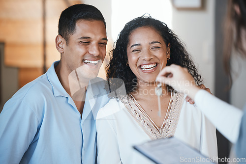 Image of Keys. realtor and a home owner couple in their apartment after payment or investment in a property asset. Real estate, mortgage or loan with a man and woman receiving the key to their new house