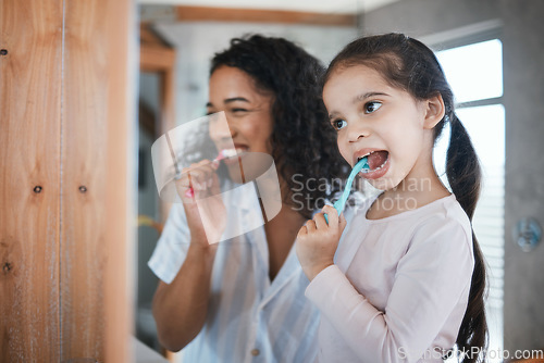 Image of Brushing teeth, child and mom with dental cleaning and learning in a bathroom. Mother, kid and smile of wellbeing and wellness with happiness of health care and toothbrush in the morning at home