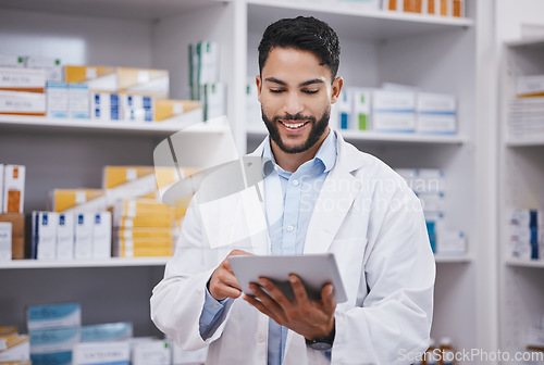 Image of Pharmacy, happy man or pharmacist reading on tablet for research or checking medical prescription on shelf. Digital or doctor with online checklist on clinic shelves or drugstore inventory storage