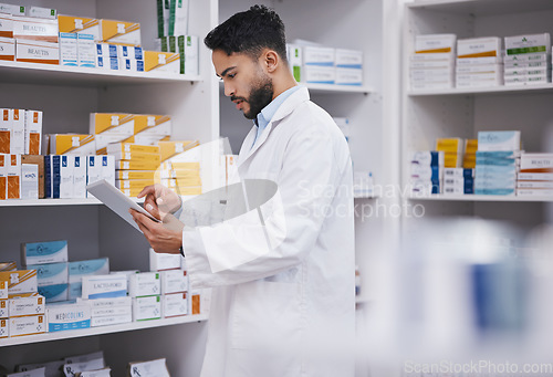 Image of Pharmacy, man or pharmacist with tablet for research or checking medical prescription on shelf. Digital, healthcare or doctor typing online checklist on clinic shelves or drugstore inventory storage