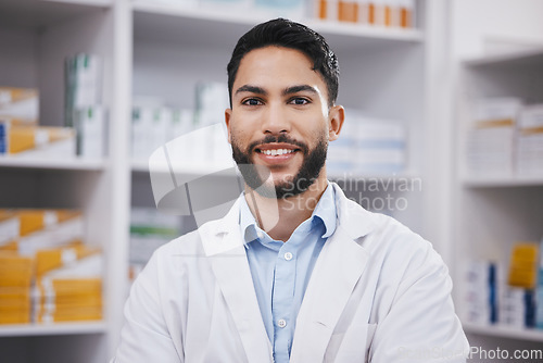 Image of Pharmacy, pharmacist or portrait of man with smile in healthcare drugstore or hospital clinic alone. Face, wellness or happy male professional smiling by medication, medicine or shelf ready to help