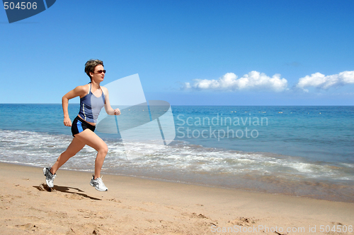 Image of Girl running on the beach