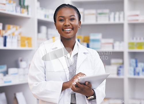 Image of Portrait of black woman in pharmacy with tablet, smile and online inventory list for medicine on shelf. Happy female pharmacist, digital checklist and medical professional checking stock in store.