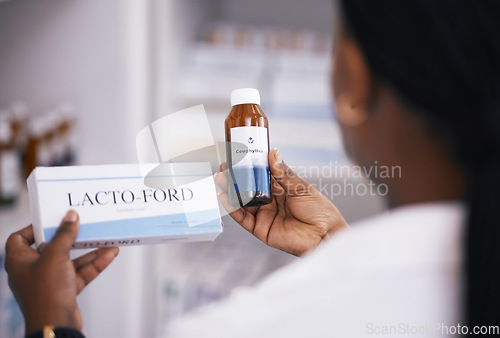 Image of Pharmacist, pills or hands of woman with medicine bottle in drugstore for healthcare stock inventory. Zoom, clinic or nurse checking or reading label info on medical products or tablets in pharmacy