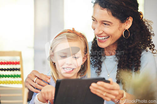 Image of Education, tablet or mother and girl in home for online lesson, homework or e learning. Child development, family and laughing mom with kid on digital tech for educational games, homeschool and study