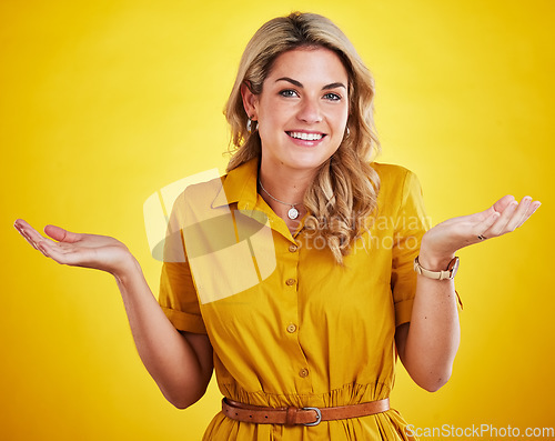 Image of Portrait, shrug and woman with a smile, confused and decision with lady against studio background. Face, female model and person with happiness, doubt and unsure with choices, hand gesture and emoji