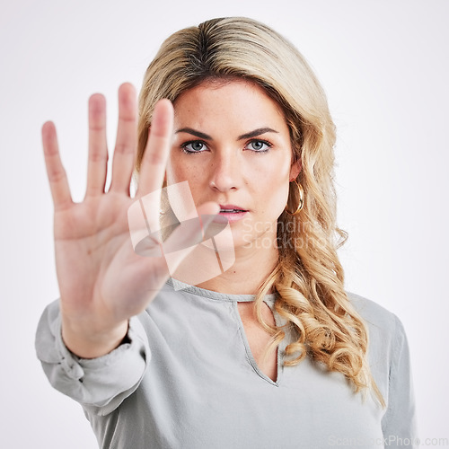 Image of Stop hand, woman and portrait in a studio with protest, emoji and warning hands gesture. Serious, self defense and female model with reject, refuse and no palm sign isolated with white background