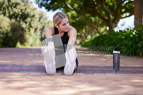 Image of Fitness, legs and woman stretching before exercise, workout or training outdoors for health and wellness. Sport, healthy and female athlete or person ready to start for performance run or marathon