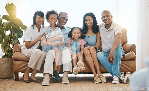 Image of Portrait, big family and smile in home living room on sofa, bonding or having fun. Happiness, parents and grandparents with children in lounge, care and enjoying quality time together on house couch.