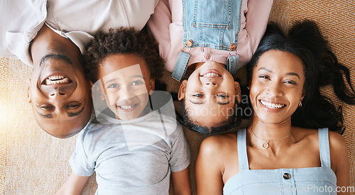 Image of Family, portrait and top view smile in house, bonding or having fun together. Parents, happiness above and children relaxing or lying on carpet floor with man and woman, care or enjoying quality time