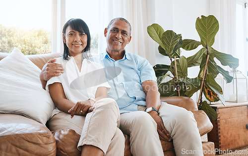 Image of Portrait, senior couple and smile in home living room on sofa, bonding and embrace in house. Couch, retirement and happiness of man and woman relaxing and enjoying quality time together in lounge.