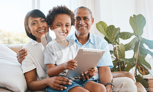 Image of Portrait, grandparents and kid smile with tablet in home living room on sofa, bonding or having fun. Family, happiness and child with grandma and grandpa, care and enjoying time together in lounge.