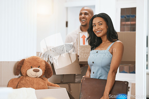 Image of Happy couple, real estate and moving in new home for renovation, property investment or relocation together. Man and woman realtor carrying boxes or luggage in the house with smile for mortgage loan