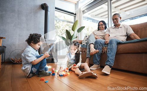 Image of Grandparents, toys and children on floor playing for relaxing, educational game and learning. Child development, family home and happy grandpa, grandmother and kids for quality time, bonding and love