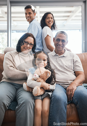 Image of Big family, portrait and couch with grandparents, child and happiness in a living room lounge. Happy, love and parent care of a mom, dad and kid with elderly people relax on a sofa in a home