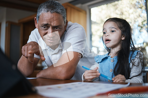 Image of Help, homework and grandfather with a child and tablet for elearning, studying and online reading. Looking, tech and a senior man helping a girl with education, project and watching a video at home