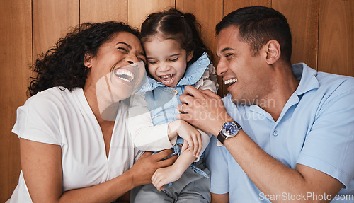 Image of Happy, funny and family with girl, parents and laughing with happiness, bonding and loving. Love, mother, and father with daughter, smile and quality time with dad, mama and female child with humor