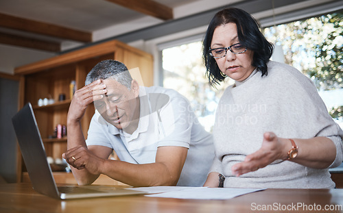 Image of Mature couple, debt and stress of budget in home with anxiety, planning money and mortgage bills. Frustrated man, woman and overwhelmed with documents, taxes and financial crisis of inflation problem