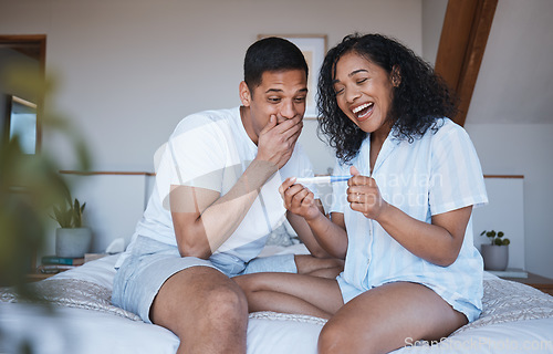 Image of Pregnant, test and excited couple in bedroom with positive results, good news and celebration at home. Pregnancy, maternity and happy man and woman on bed with for fertility, family and surprise