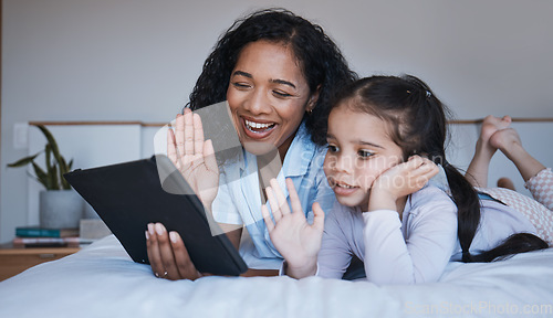 Image of Tablet, mother and girl wave in video call on bed in home bedroom, talking or speaking. Technology, happiness and mom and child in virtual chat, online conversation and waving while live streaming.