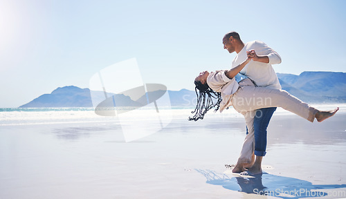 Image of Couple, beach and dance with happiness by space for mockup with sunshine, summer and holiday with love. Man, woman and dancing with smile, romance and sky mock up by ocean with bonding on vacation