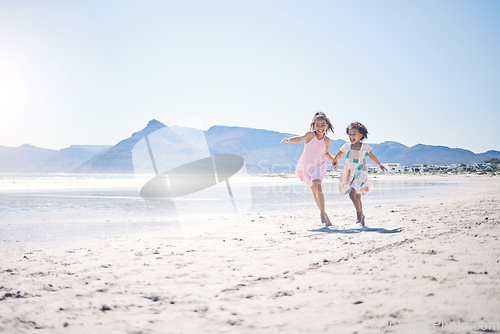 Image of Girl kids, holding hands and run at beach with space for mockup by water, together and bond with love in summer. Female children, play game or race for siblings, family and ocean mock up in sunshine