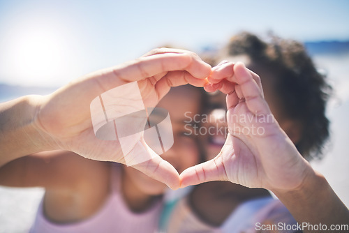 Image of Happy, outdoor and girls with heart hands, support and wellness on break, relax or bonding. Friends, young people or children with happiness, symbol for love or emoji with care, solidarity or outside