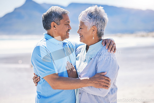 Image of Senior couple, hug and sea vacation outdoor with love and romance in nature. Ocean, elderly and old woman and man together on summer holiday by the sea feeling happiness and relax on a beach