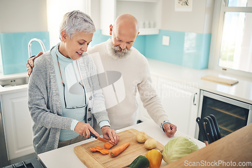 Image of Cooking, food and an old couple in the kitchen of their home together during retirement for meal preparation. Health, wellness or nutrition with a senior man and woman making supper in their house