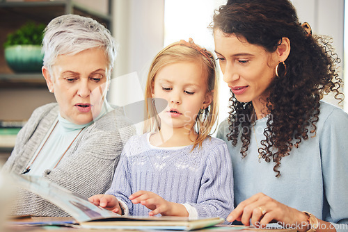 Image of Grandmother, mama and girl reading a book, bonding and happiness for fun, quality time and relax. Family, parent or granny with mom, daughter or female child with storytelling, literature or learning