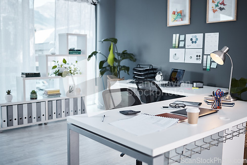 Image of Empty office, interior and workspace with furniture, table and professional layout in startup agency. Background of modern workplace, business building and room in company, job venue or minimal setup